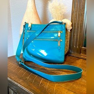 Cole Haan crossbody bag. Patent on the outside. Beautiful blue EUC